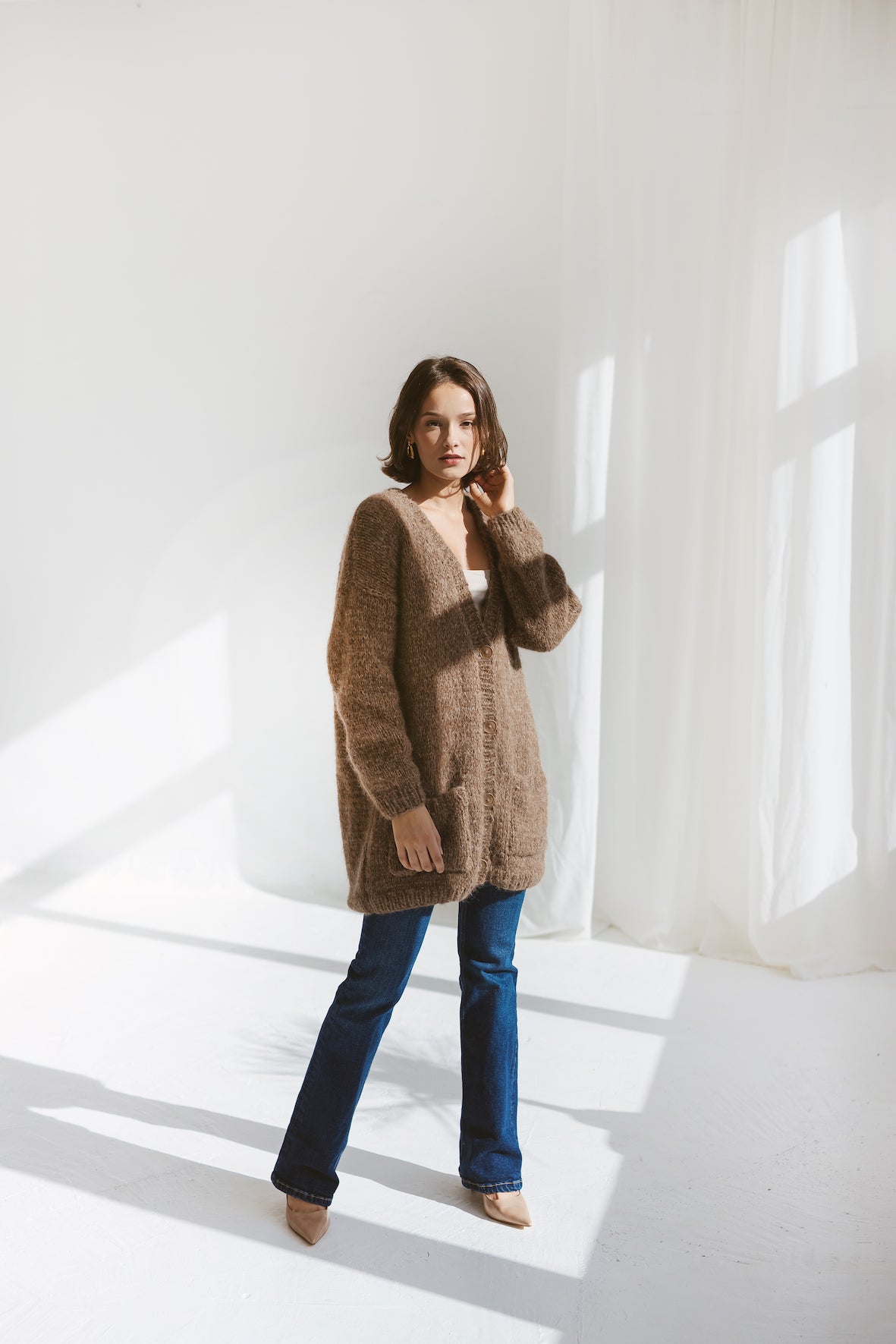 Beige cardigan with pockets and buttons