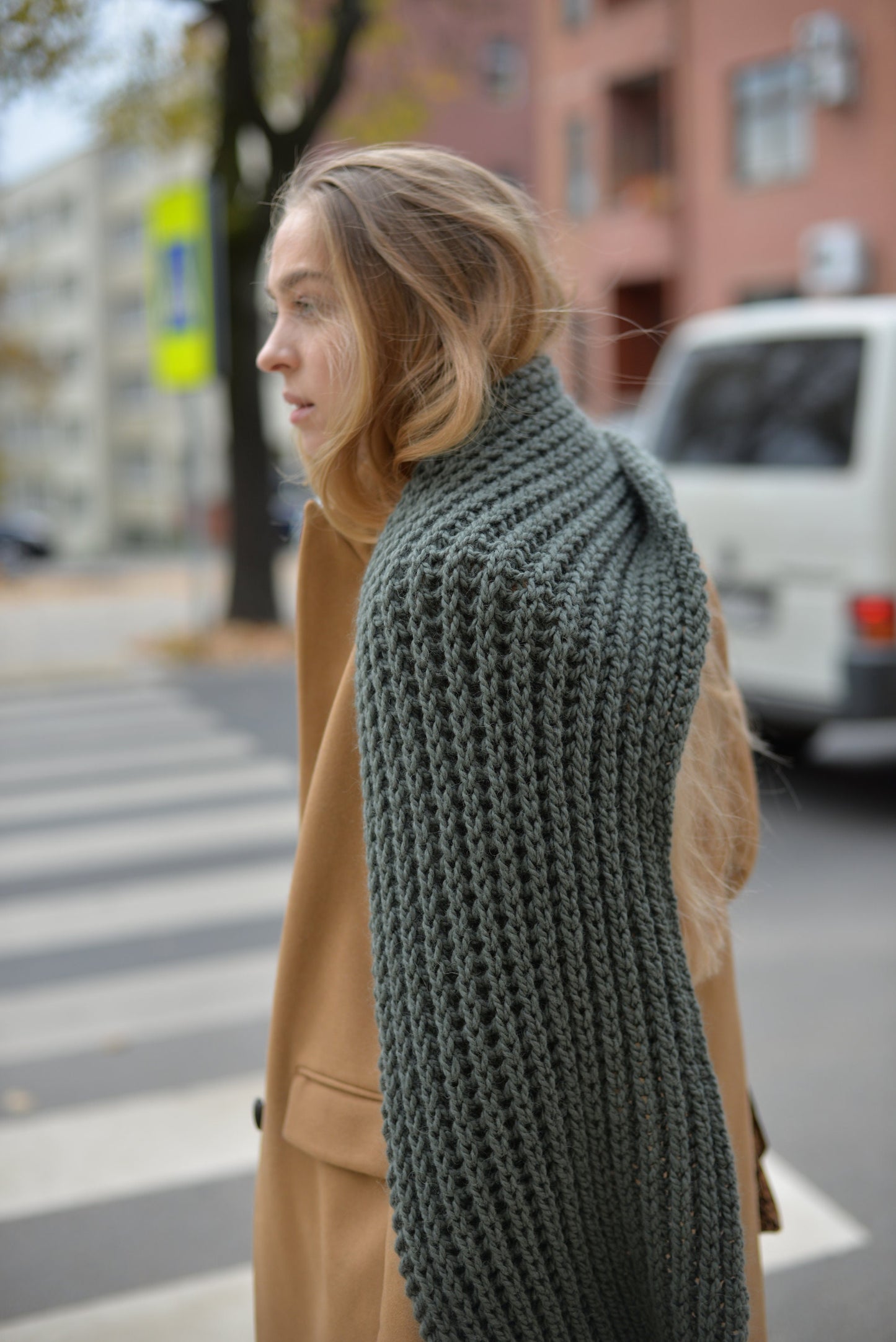 Green knit scarf. This chunky knit wool and alpaca scarf will keep you warm and cosy.
