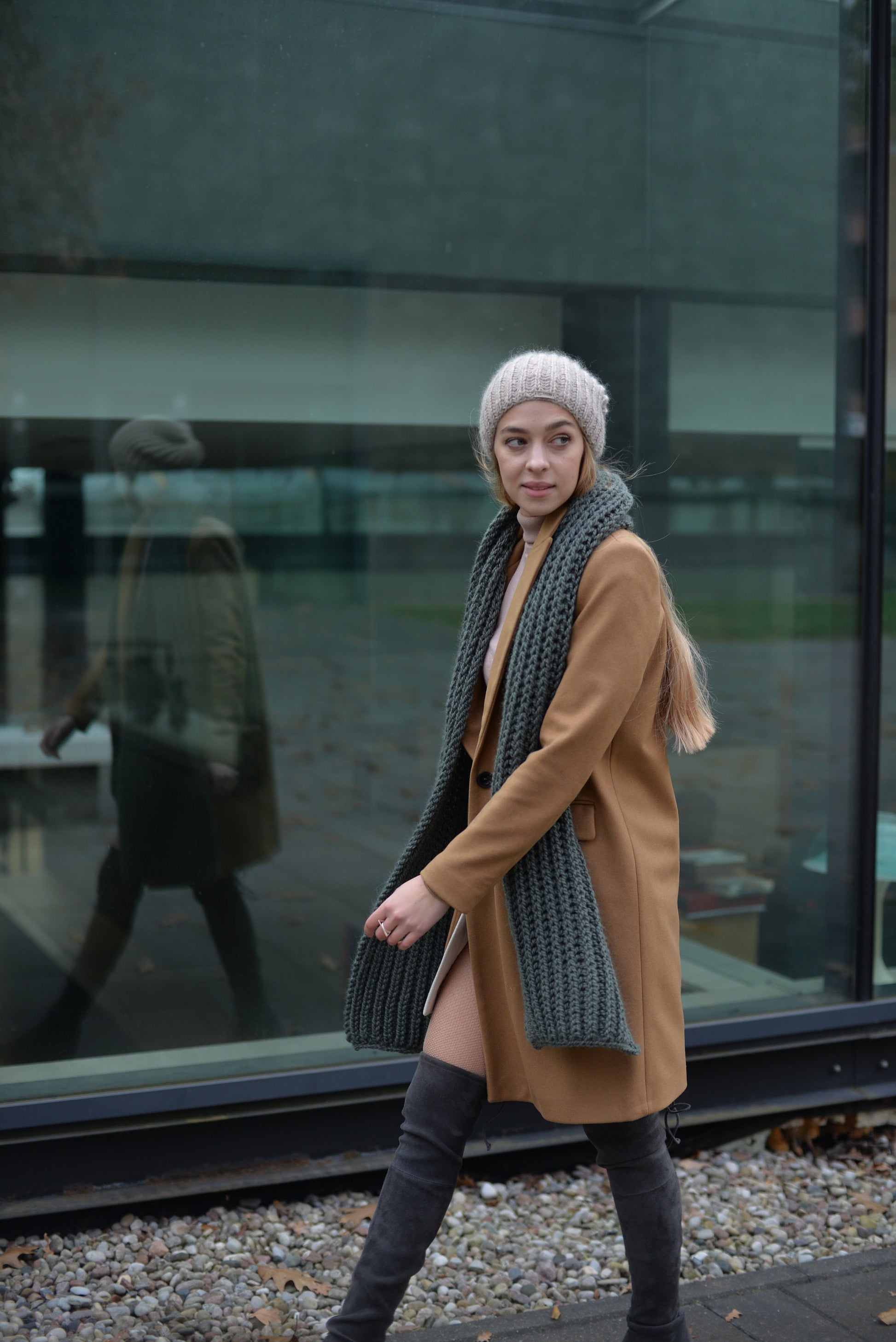 Green knit scarf. This chunky knit wool and alpaca scarf will keep you warm and cosy.