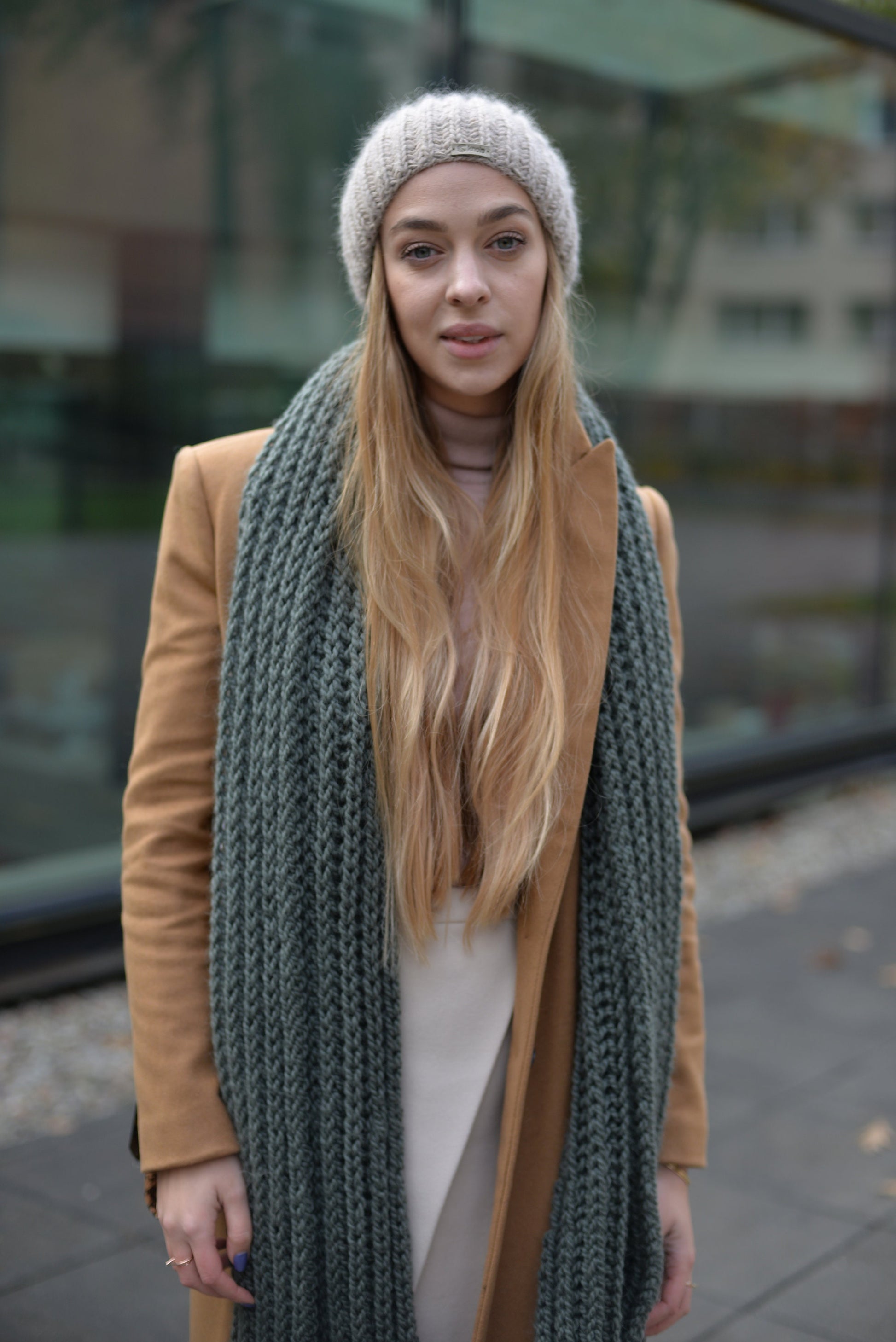 Green knit scarf. This chunky knit wool and alpaca scarf will keep you warm and cosy.