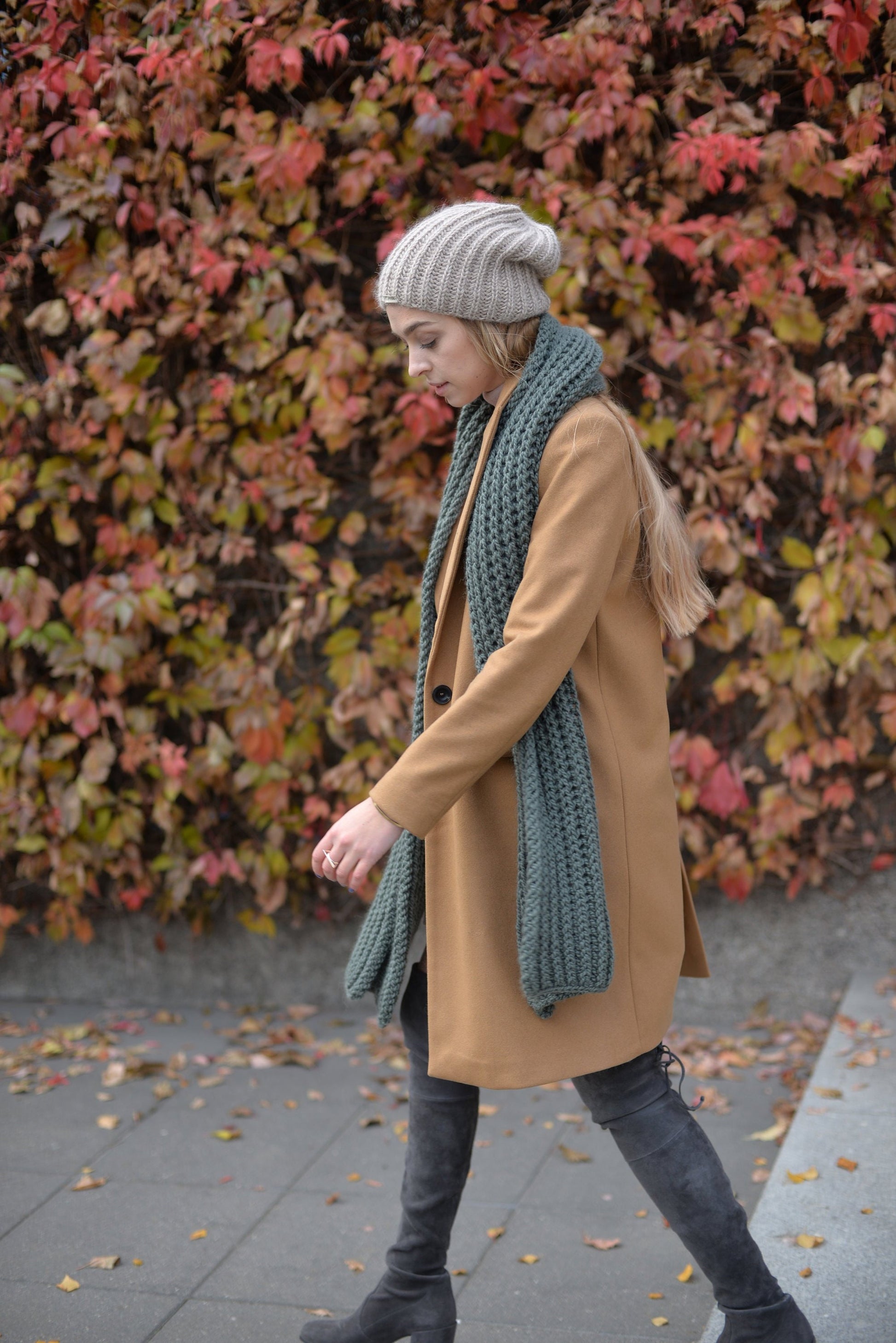 Green knit scarf. This chunky knit wool and alpaca scarf will keep you warm and cosy.