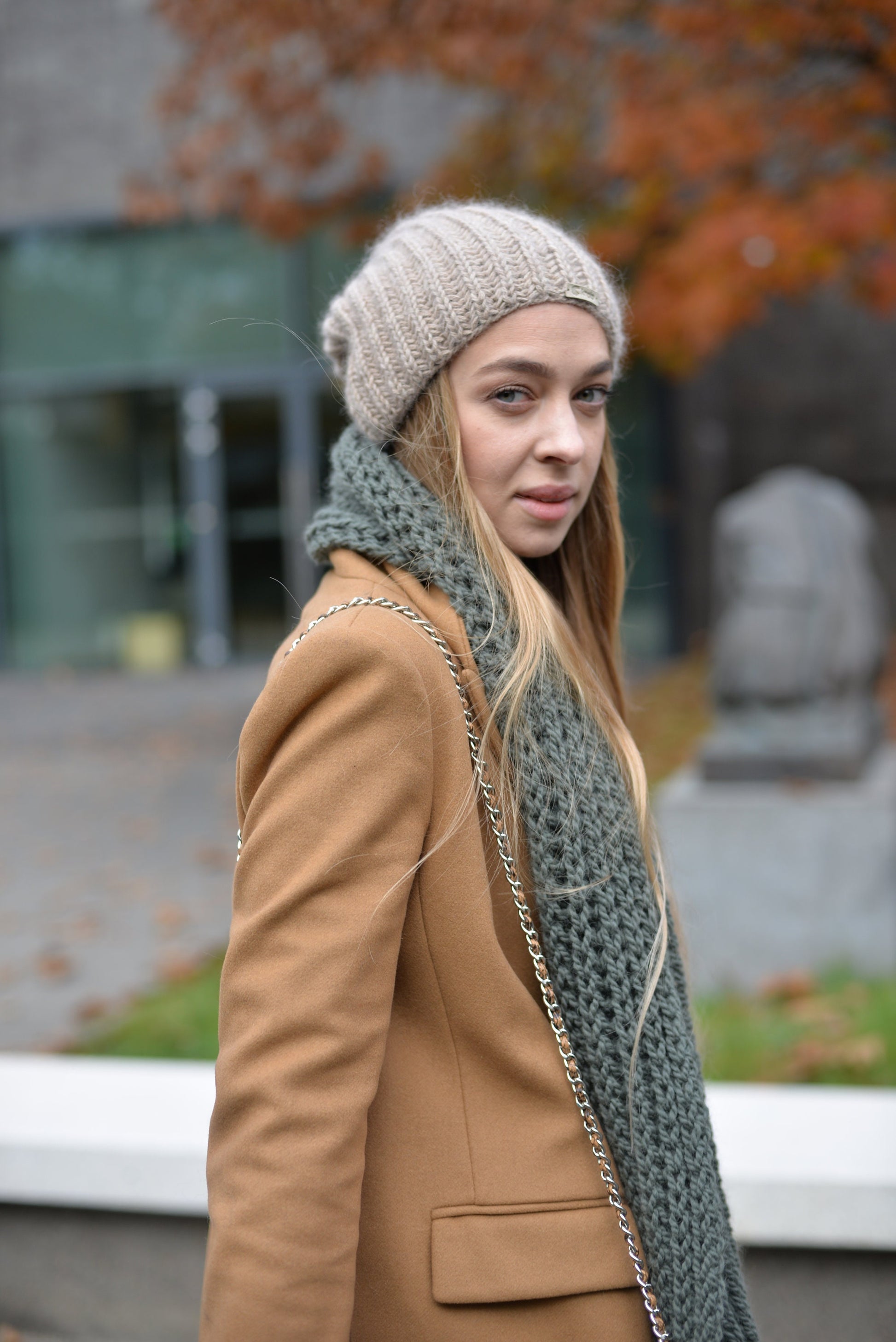 Green knit scarf. This chunky knit wool and alpaca scarf will keep you warm and cosy.