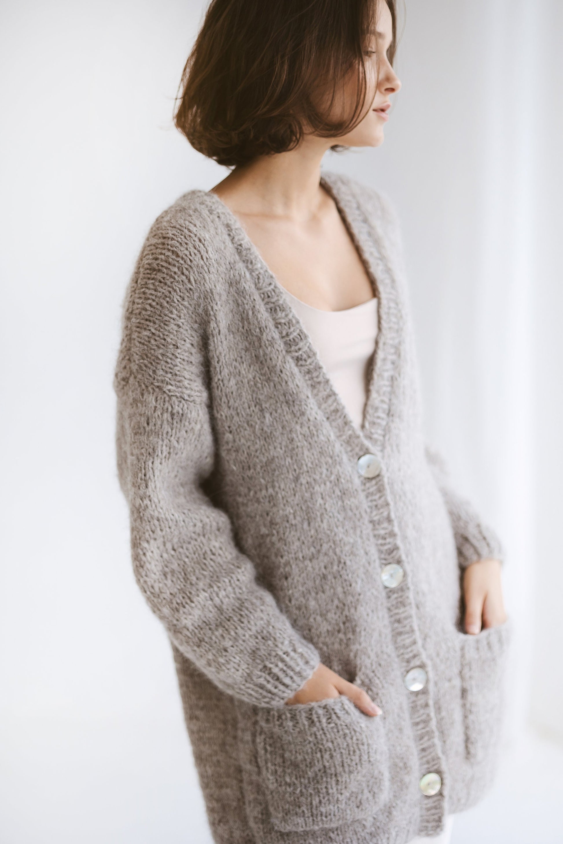 Grey Alpaca Cardigan With Pockets, Light Grey Relaxed Cable Knit Buttoned Cardigan, Light Gray Chunky Knit Alpaca Wool Sweater With Buttons