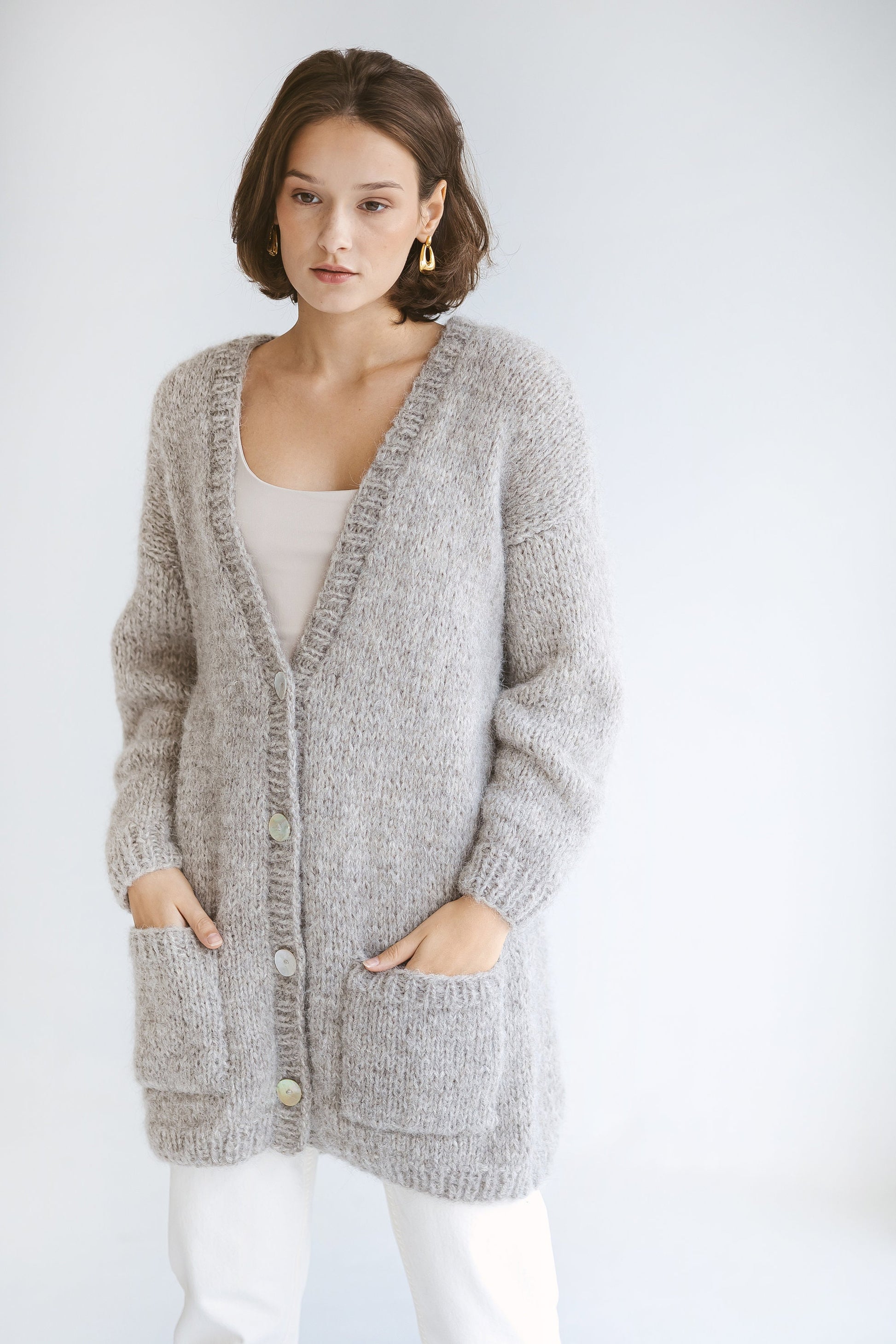 Grey Alpaca Cardigan With Pockets, Light Grey Relaxed Cable Knit Buttoned Cardigan, Light Gray Chunky Knit Alpaca Wool Sweater With Buttons