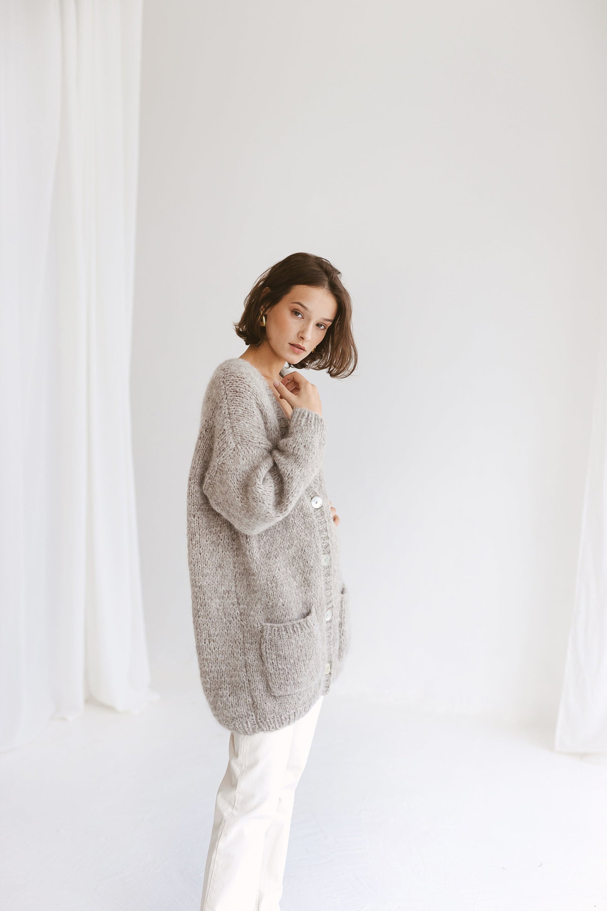 Grey Alpaca Cardigan With Pockets, Light Grey Relaxed Cable Knit Buttoned Cardigan, Light Gray Chunky Knit Alpaca Wool Sweater With Buttons
