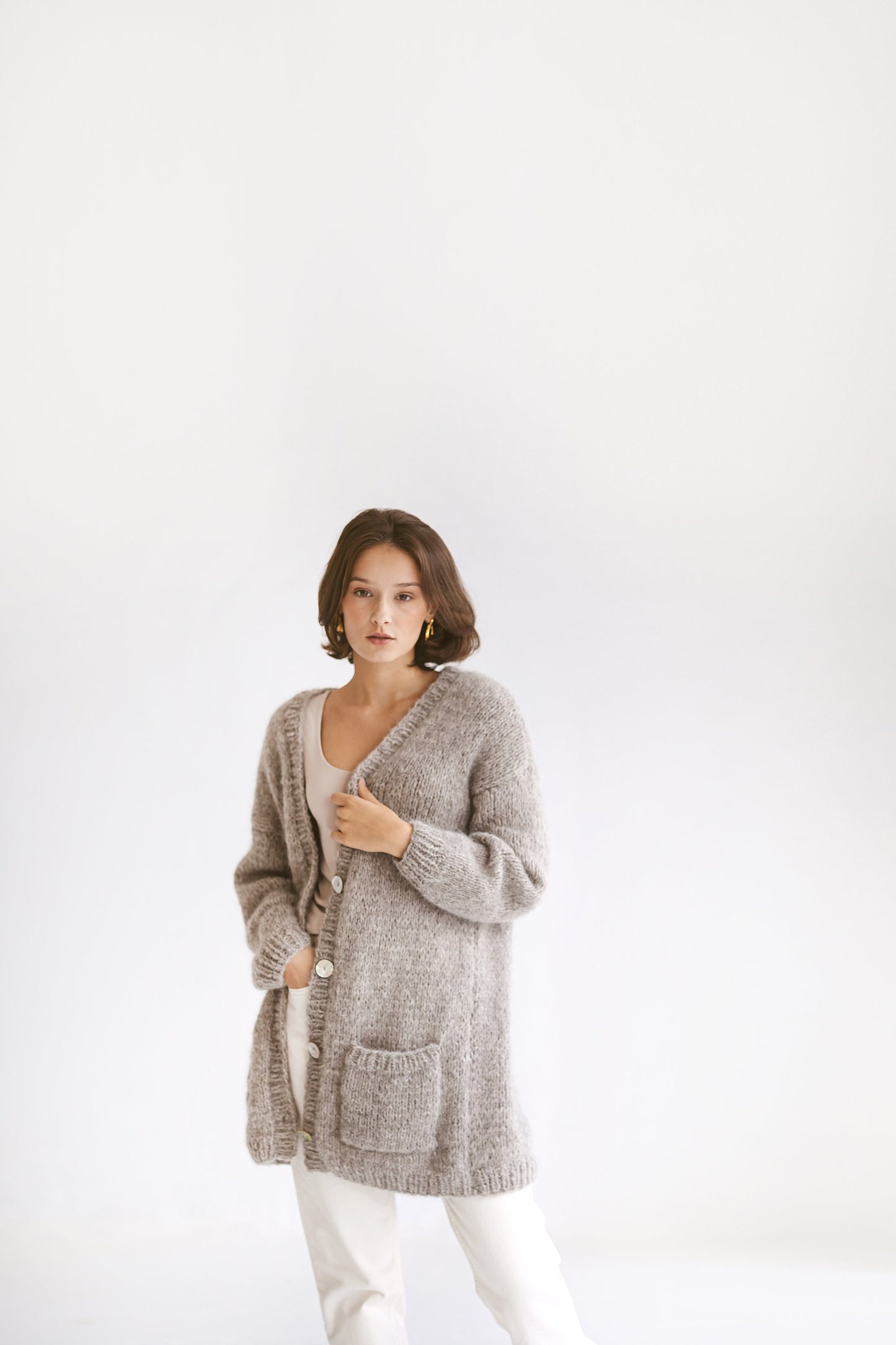 Grey Alpaca Cardigan With Pockets, Light Grey Relaxed Cable Knit Buttoned Cardigan, Light Gray Chunky Knit Alpaca Wool Sweater With Buttons