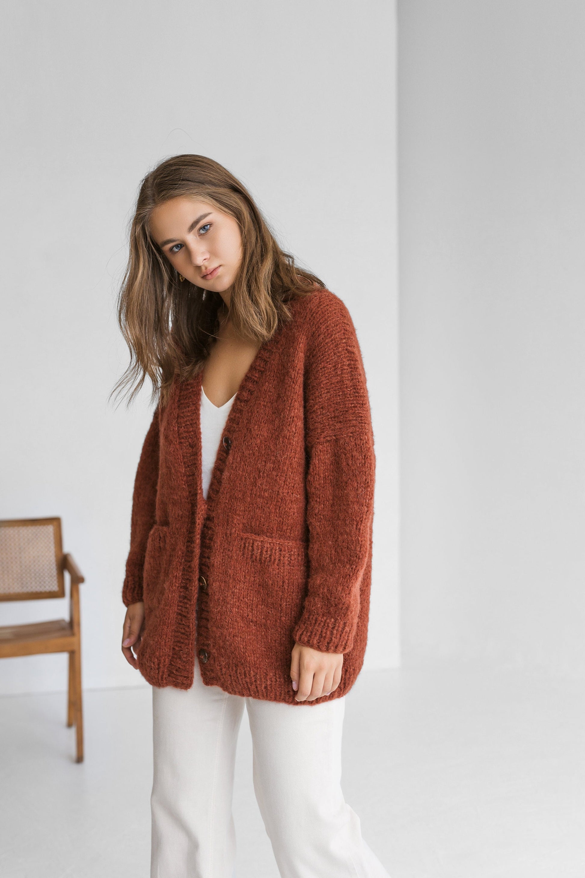 Rust cable knit alpaca wool cardigan with buttons, orange slightly oversized buttoned woolen sweater with pockets, ginger chunky knitted