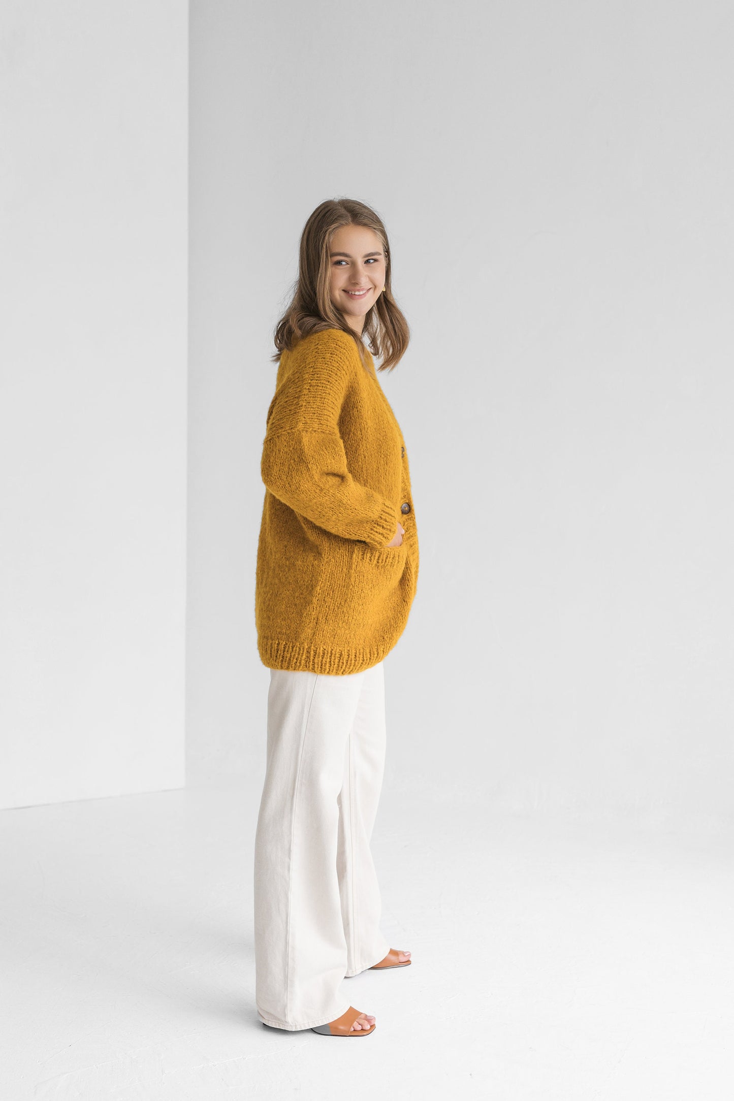 Yellow cable knit alpaca wool cardigan with buttons, curry slightly oversized buttoned woolen sweater with pockets, mustard chunky knitted